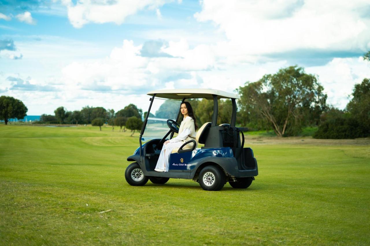 The View Bouznika Hotel Buitenkant foto Golf cart